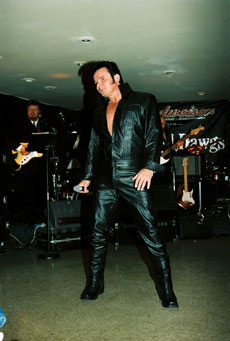 Mike as Elvis with black leather costume